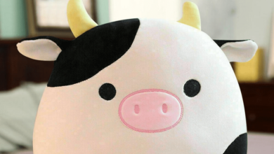 This adorable stuffed animal is a Squishmallow Highland Cow.